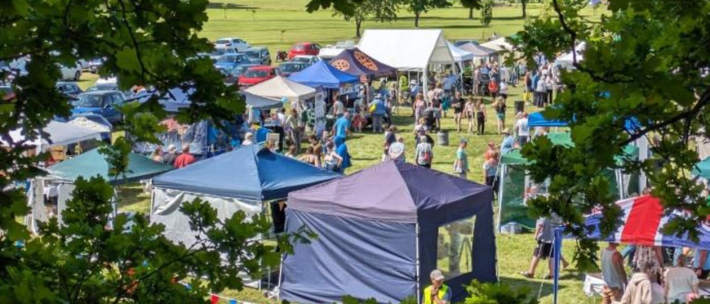 View across Rollo Park showing market stalls at Little Dunning © Andrew Wilkie